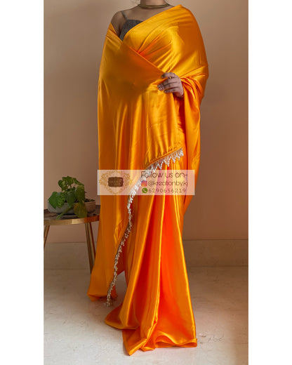 Saffron Satin Silk Saree with Handmade Tassels on Pallu