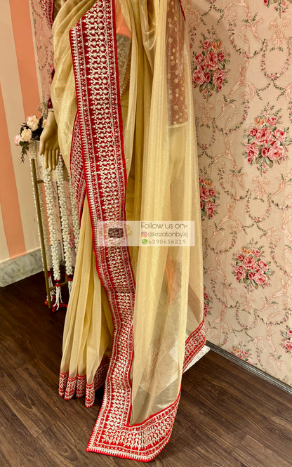 Beige Tissue Net Saree with Red Border