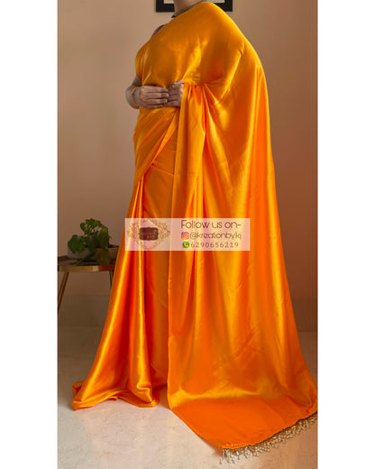 Saffron Satin Silk Saree with Handmade Tassels on Pallu