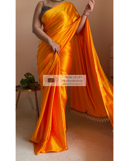 Saffron Satin Silk Saree with Handmade Tassels on Pallu