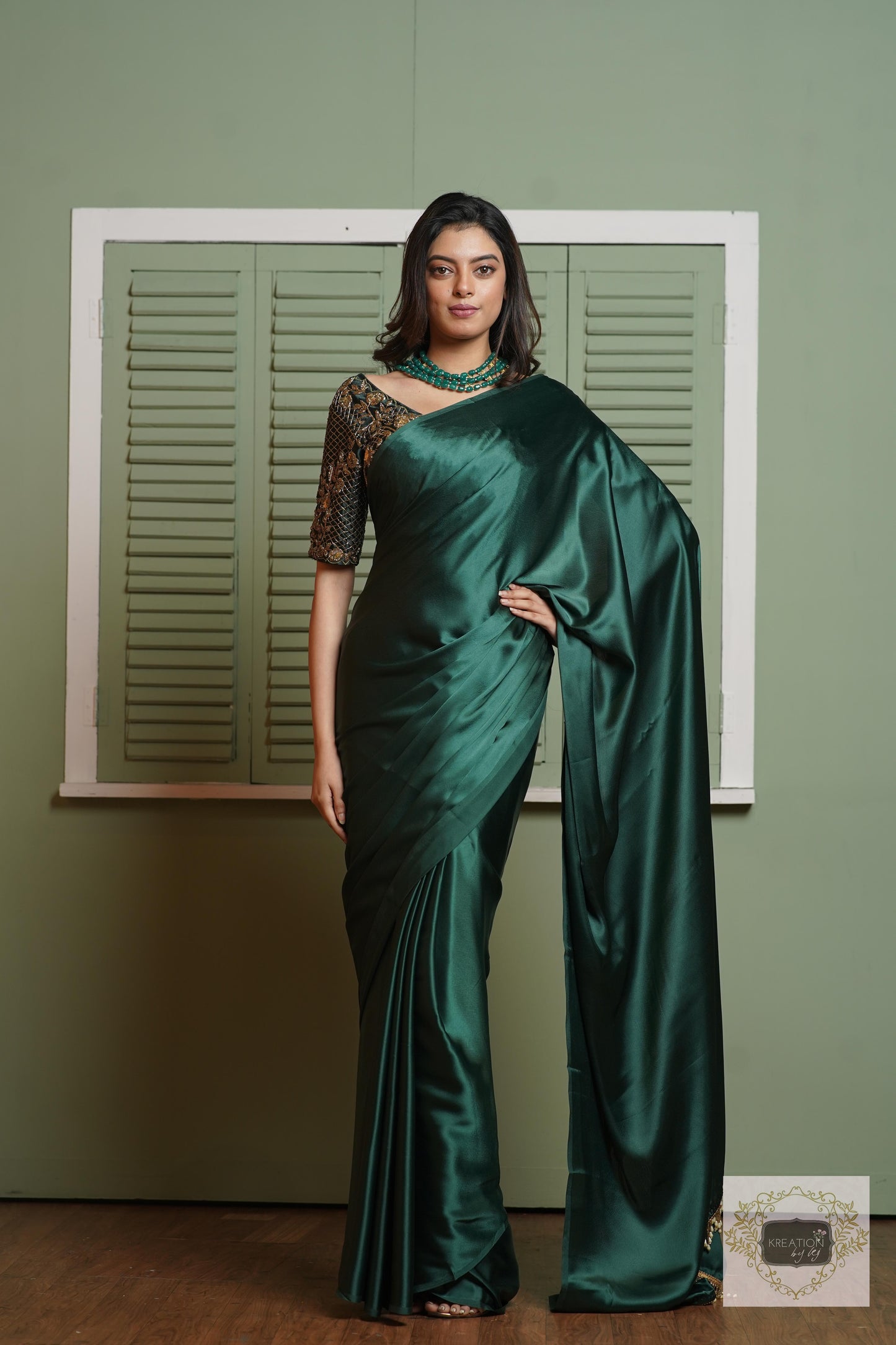 Emerald Green Satin Silk Saree With Handmade Tassels On Pallu