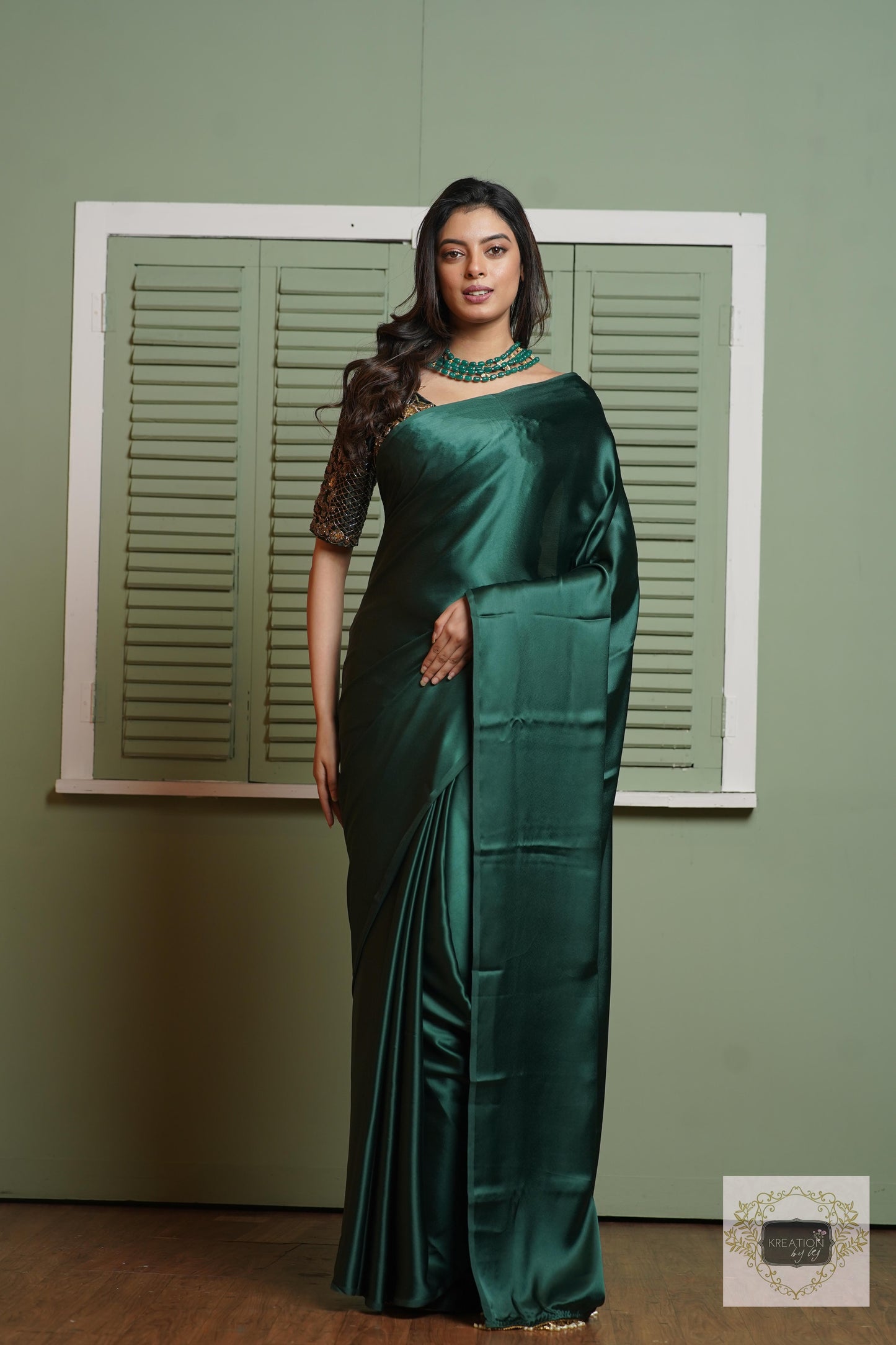 Emerald Green Satin Silk Saree With Handmade Tassels On Pallu