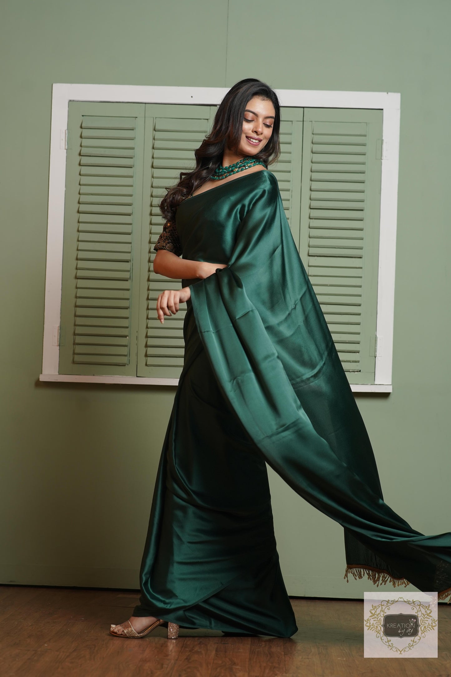 Emerald Green Satin Silk Saree With Handmade Tassels On Pallu