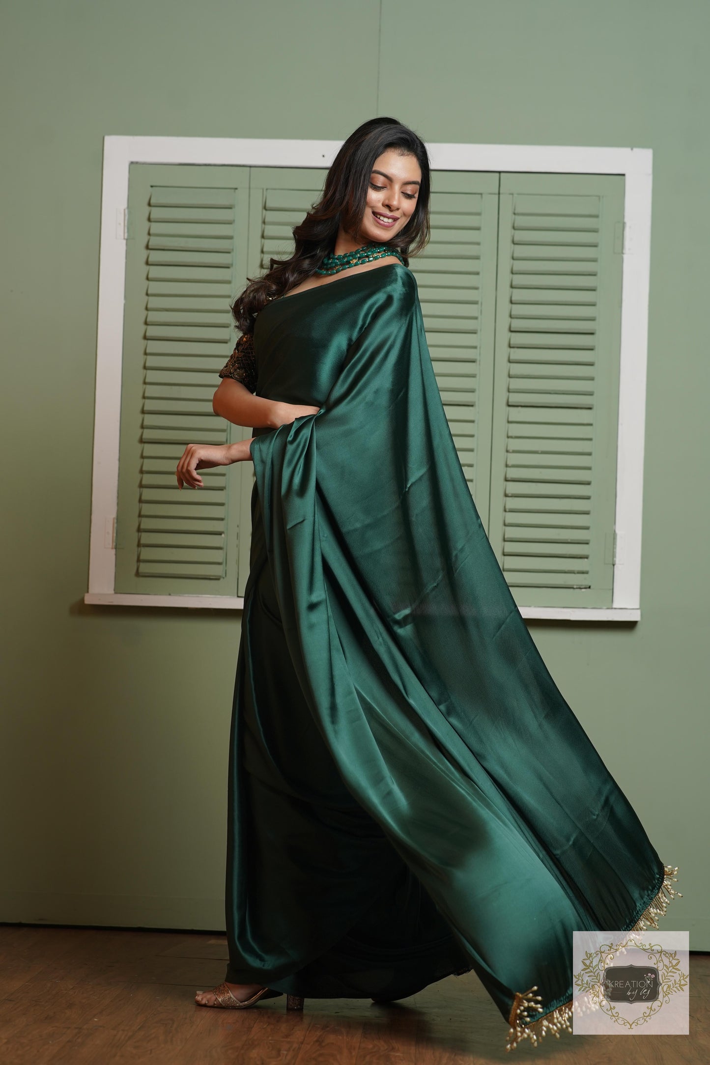 Emerald Green Satin Silk Saree With Handmade Tassels On Pallu