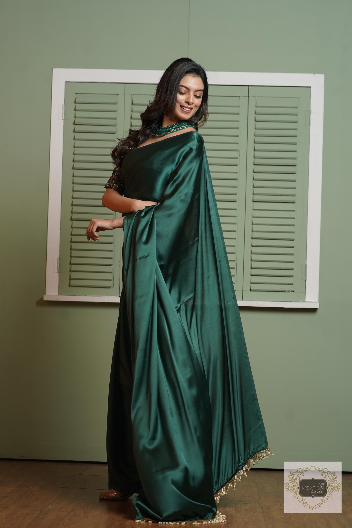 Emerald Green Satin Silk Saree With Handmade Tassels On Pallu