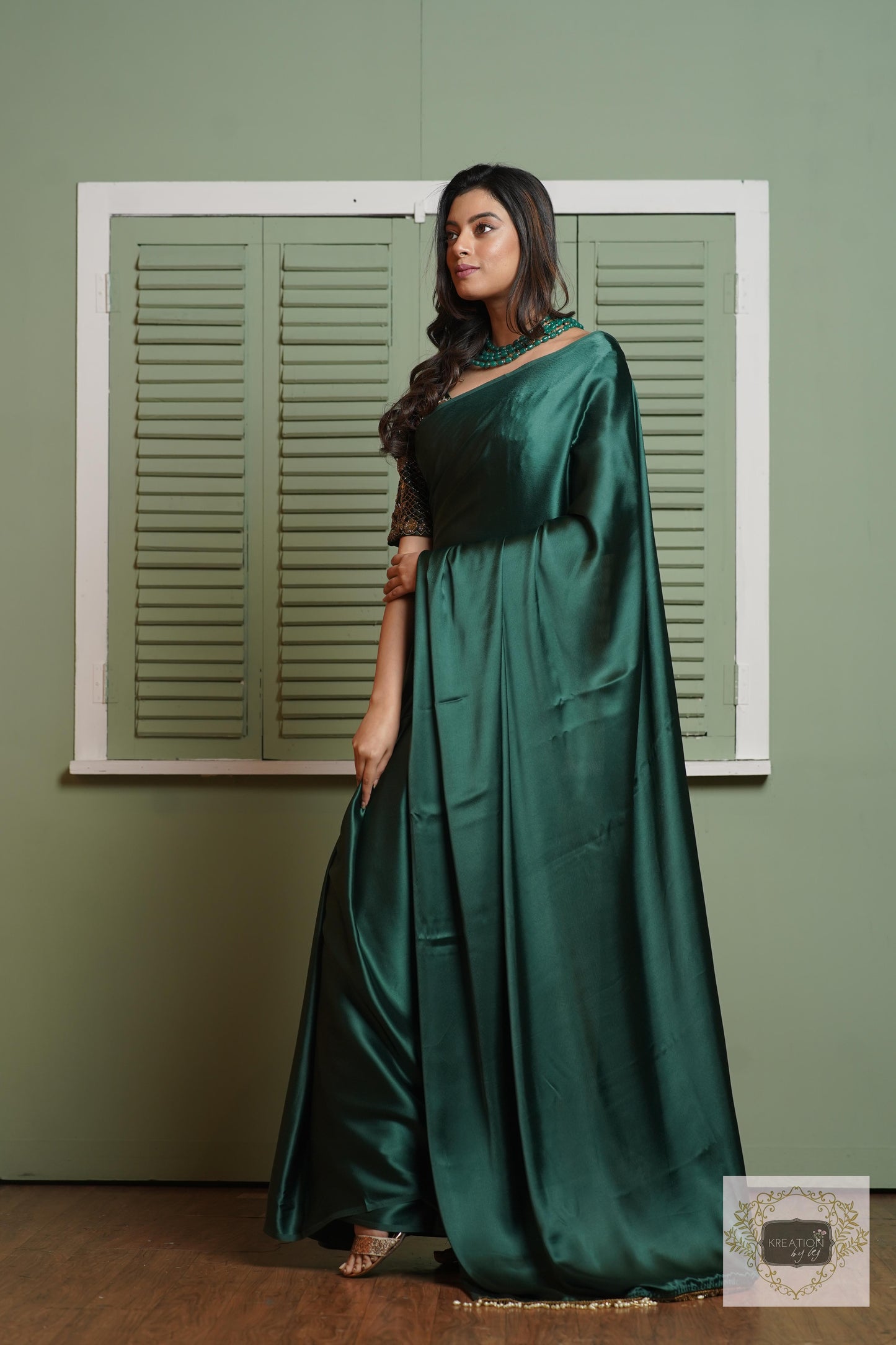 Emerald Green Satin Silk Saree With Handmade Tassels On Pallu