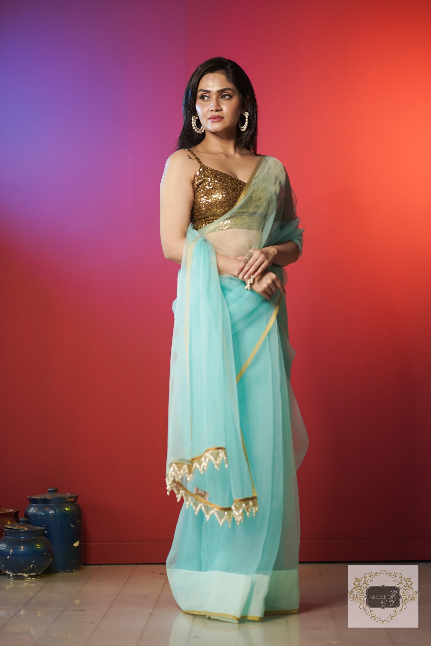 Ice Blue Organza Saree With Handmade Tassels On Pallu