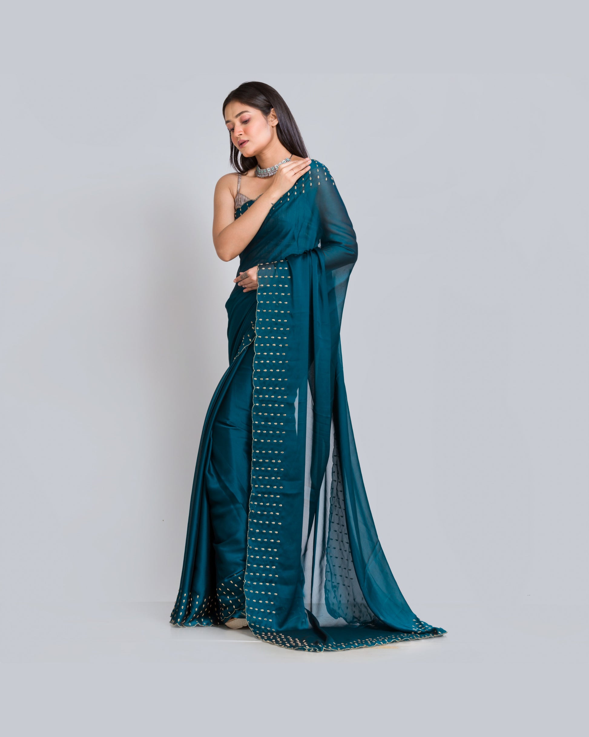 Teal Blue Georgette Silk Saree With Handembroidered Dabka Motifs On Border - kreationbykj